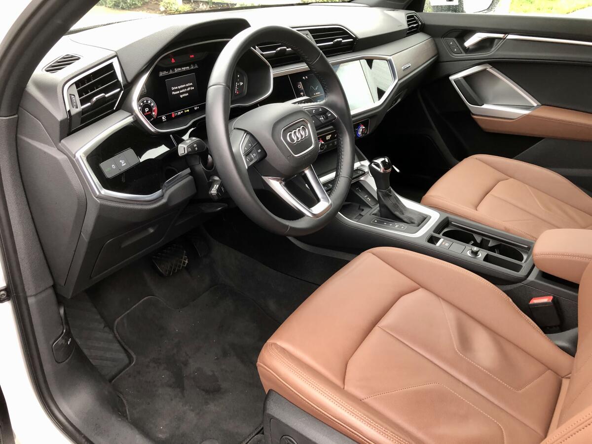 The cabin is handsomely crafted with an emphasis on driver focus, with a light angling of the center control touch screen to the driver.
