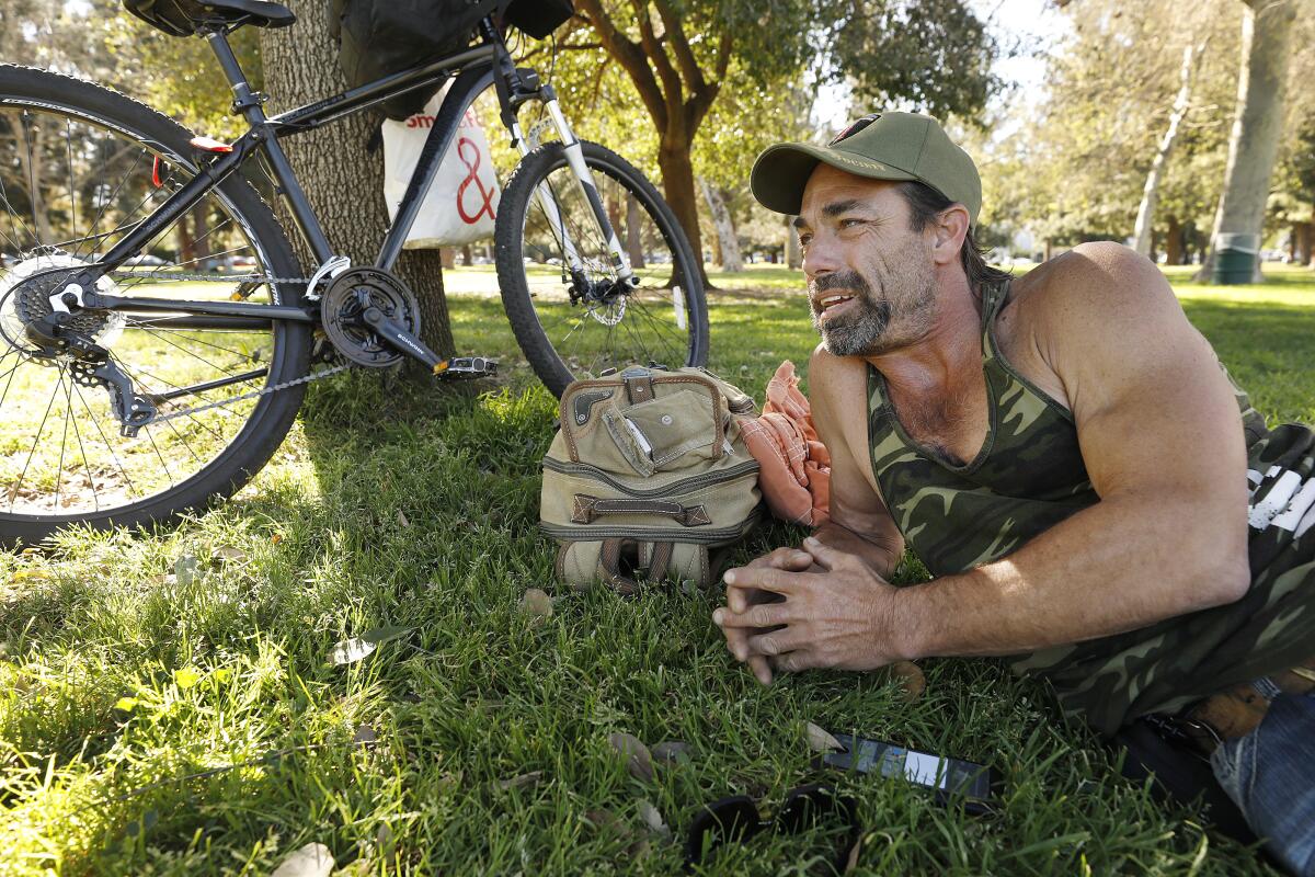 Paul Dempsey, 51, homeless and living on the streets of Woodland Hills rides his bicycle that he was able to barter for.