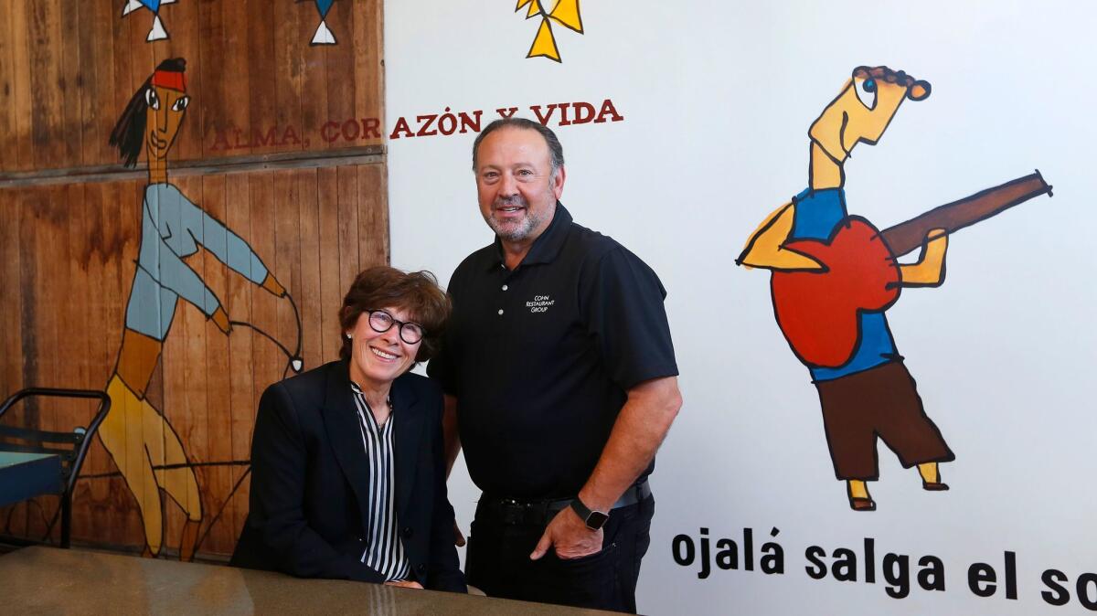 Lesley and David Cohn, at their non-profit taco shop Libertad. The concept raised the couple's charitable giving bar even higher.