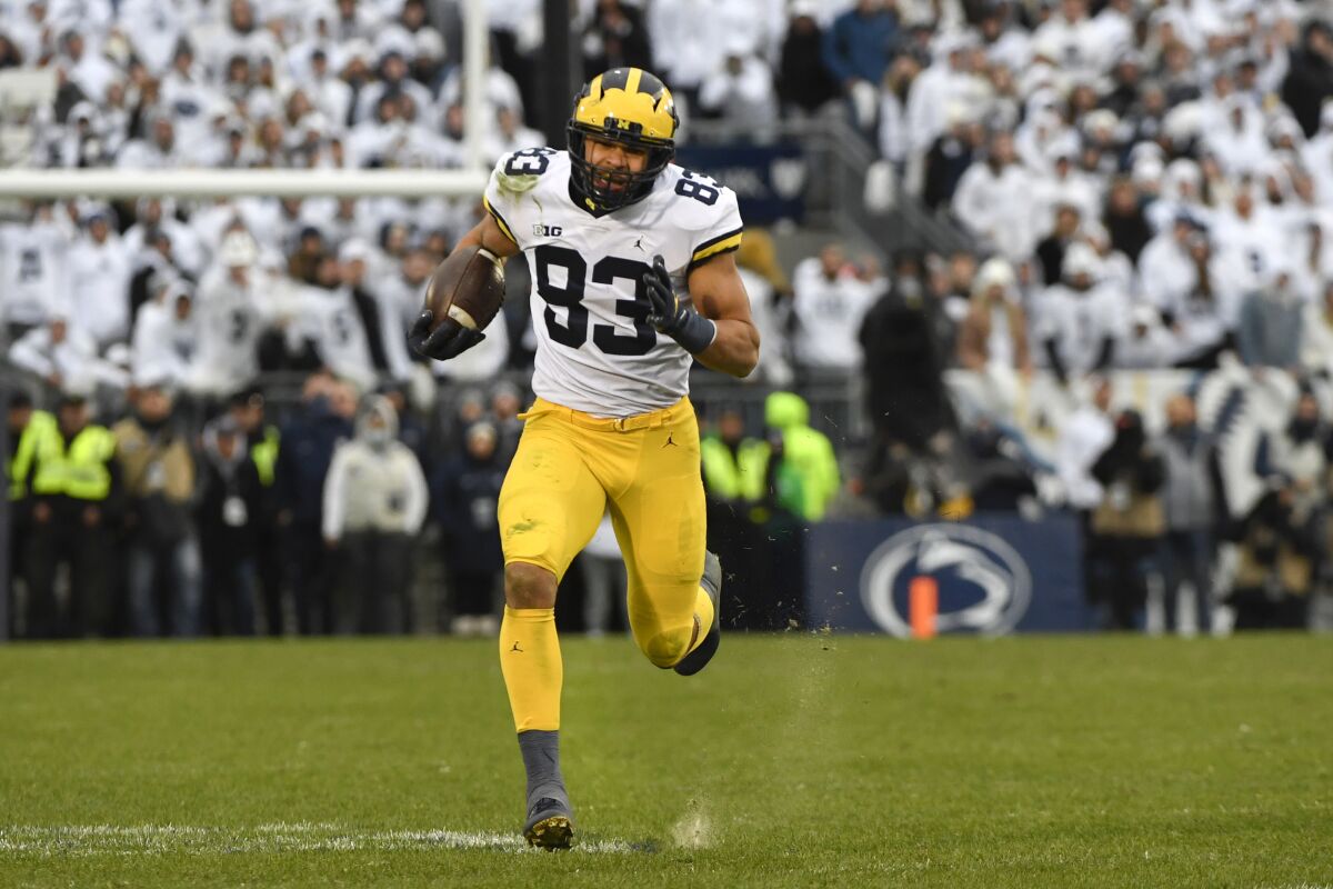 Michigan tight end Erick All (83) sprints to the end zone to score on a 47-yard touchdown pass in the fourth quarter against Penn State during an NCAA college football game in State College, Pa., Saturday, Nov. 13, 2021. Michigan defeated Penn State 21-17. (AP Photo/Barry Reeger)