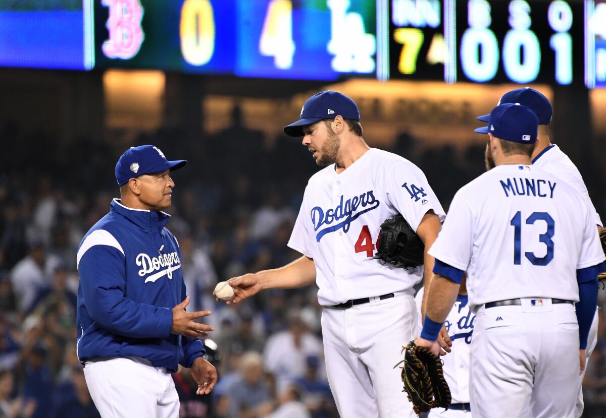 Los Angeles Dodgers manager Dave Roberts pulls starting pitcher Rich Hill.