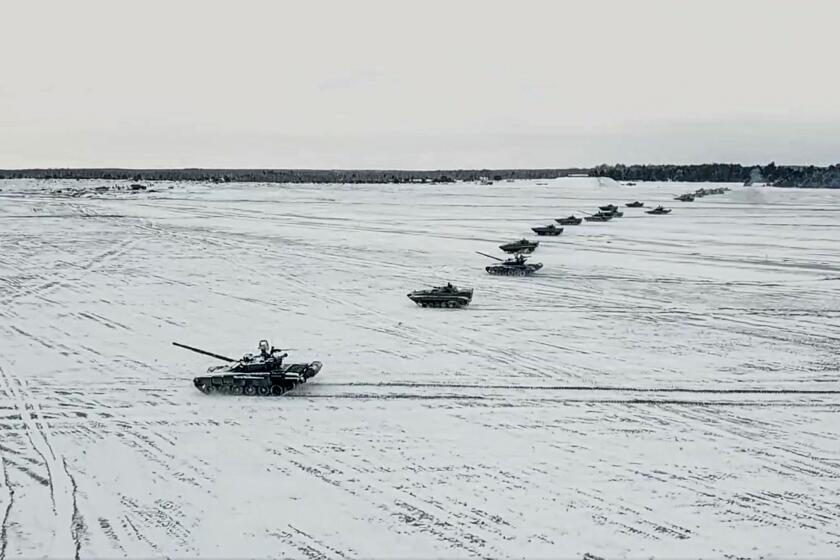 FILE - In this photo taken from video and released by the Russian Defense Ministry Press Service on Friday, Feb. 4, 2022, tanks and armored vehicles move during the Belarusian and Russian joint military drills at Brestsky firing range, Belarus. With Russia carrying out a massive military buildup near Ukraine and the West roundly rejecting Moscow’s security demands, a window for diplomacy in the crisis appears to be closing. But even as Moscow continues to bolster its forces and holds sweeping war games, President Vladimir Putin is keeping the window open for more negotiations in a calculated game of brinkmanship intended to persuade Washington and its allies to accept Russia's demands. (Russian Defense Ministry Press Service via AP, File)