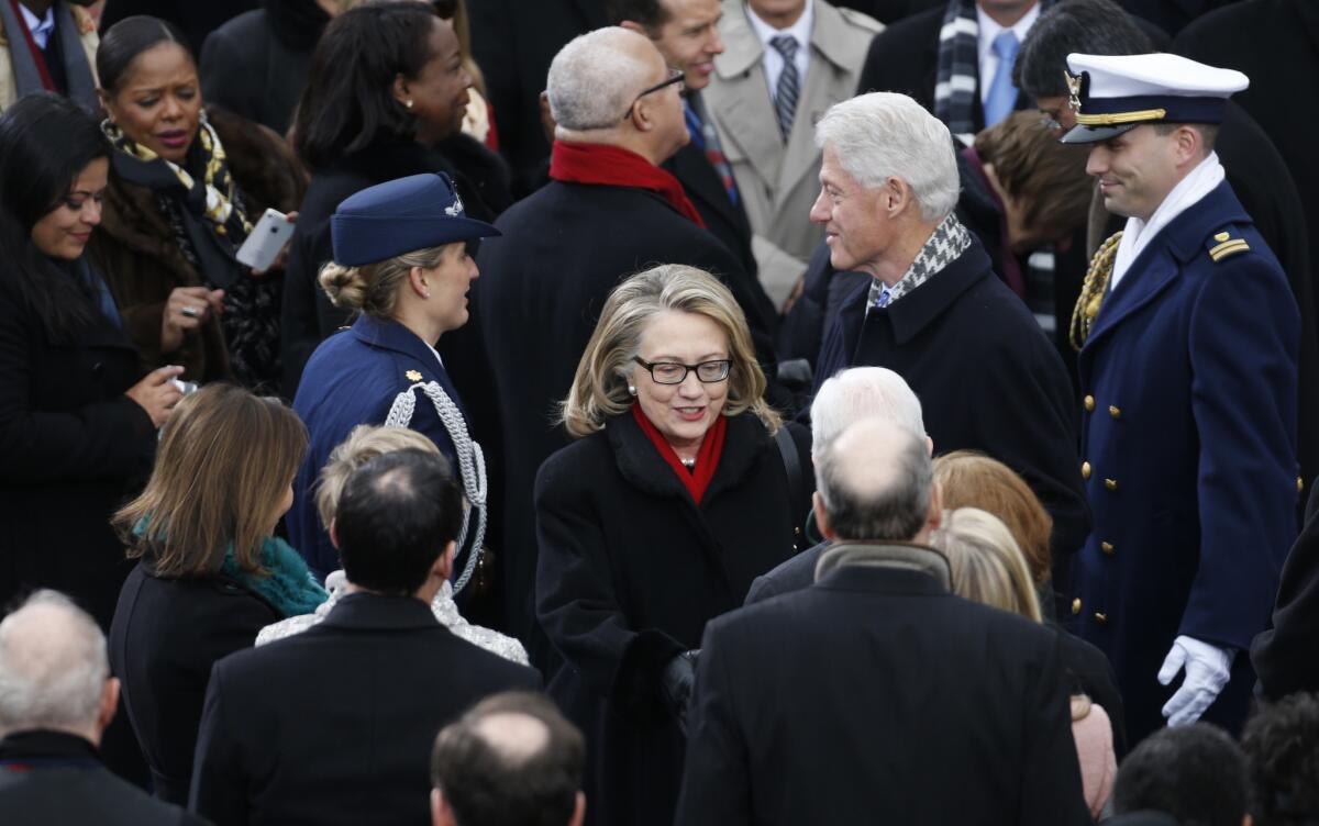 Bill and Hillary Clinton attend President Obama's second inauguration in 2013. (Brian Cassella / Chicago Tribune)