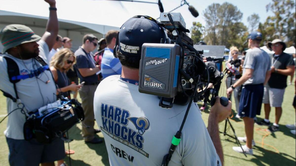 "Hard Knocks" camera crews document every move at the Rams' training camp at UC Irvine, from the field to the locker room.