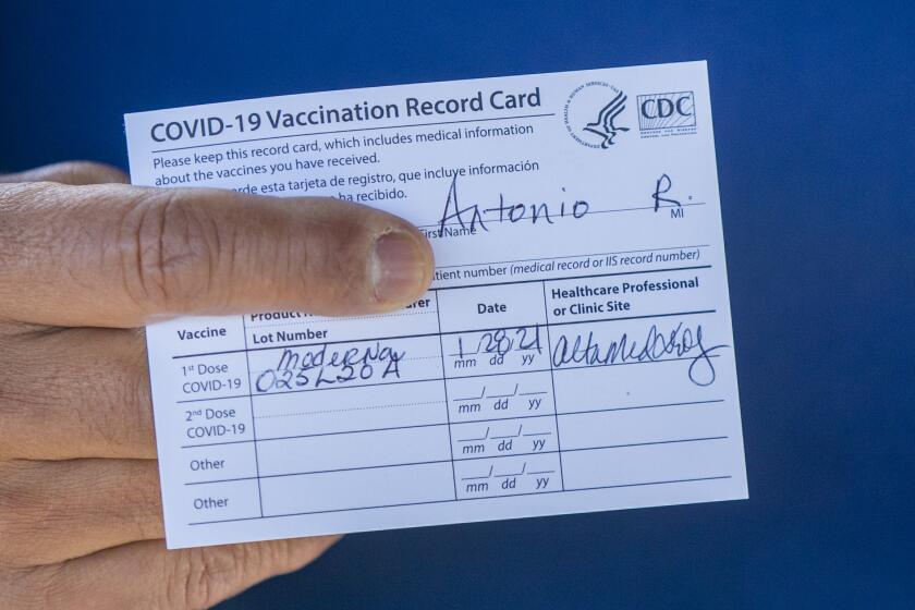 Anaheim, CA - January 28: Former Los Angeles Mayor Antonio Villaraigosa holds his vaccination card after receiving his first shot of the Moderna COVID-19 vaccination at AltaMed Health Services Medical and Dental Group in Anaheim Thursday, Jan. 28, 2021. Villaraigosa wants to send a message to encourage other seniors to get their vaccination shots. (Allen J. Schaben / Los Angeles Times)