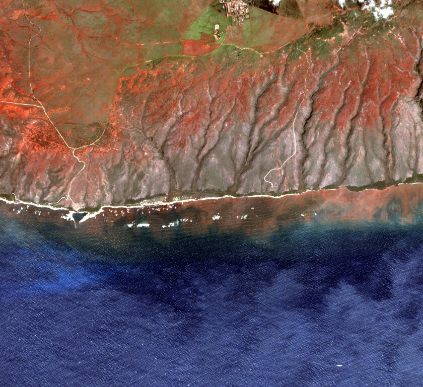 In this 2020 satellite image provided by the Arizona State University's Center for Global Discovery and Conservation Science, Allen Coral Atlas, runoff from the island of Molokai in Hawaii flows into the ocean. Recent flooding in Hawaii caused widespread and obvious damage. But extreme regional rain events that are predicted to become more common with global warming do not only wreak havoc on land, the runoff from these increasingly severe storms is also threatening Hawaii's coral reefs. (Arizona State University's Center for Global Discovery and Conservation Science, Allen Coral Atlas via AP)