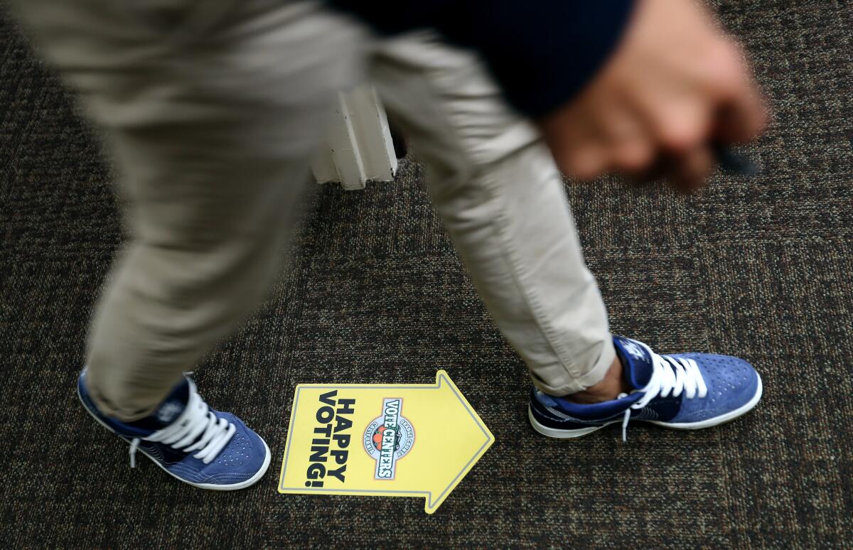 A voter enters the voting area at the Civic Center in Huntington Beach in 2020.
