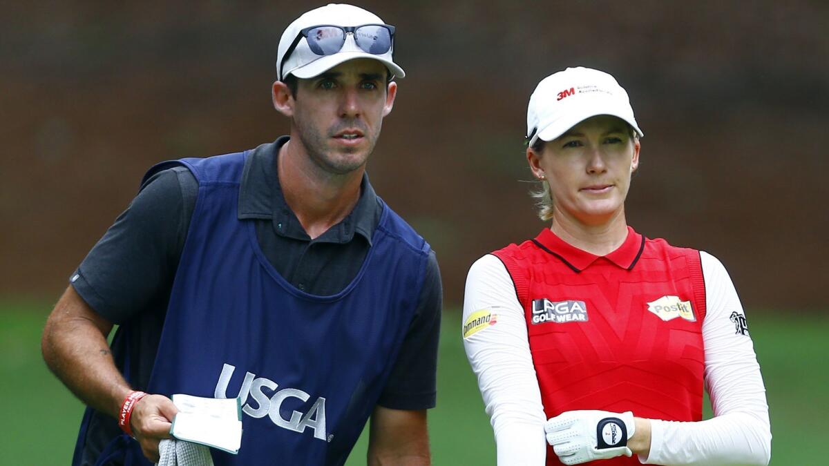 Sarah Jane Smith and her caddie husband, Duane Smith, talk about her tee shot on the 18th hole during the second round of the U.S. Women's Open golf tournament at Shoal Creek, on June 1, 2018, in Birmingham, Ala.