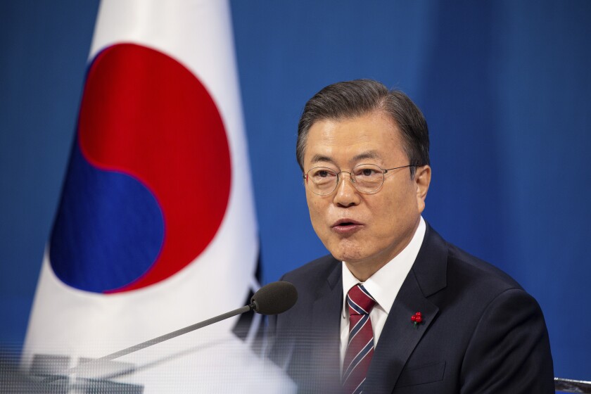 South Korean President Moon Jae-in speaks during an on-line New Year press conference with local and foreign journalists at the Presidential Blue House in Seoul, South Korea Monday, Jan. 18, 2021. (Jeon Heon-kyun/Pool Photo via AP)
