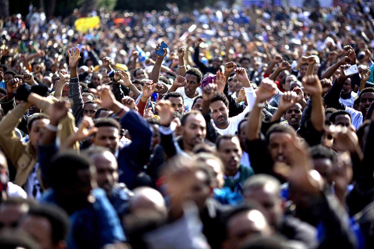 African immigrants chant slogans during a January protest in Rabin Square in Tel Aviv. The Africans, mostly young men from Sudan and Eritrea, started crossing into Israel from Egypt in large numbers about eight years ago.
