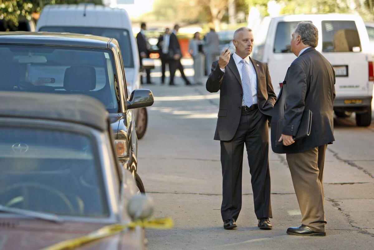 Investigators were scouring a Silver Lake neighborhood on Thursday, Nov. 14, 2013, where Joseph Gatto, 78, the father of Assemblyman Mike Gatto, was found shot to death in the family's home the night before.