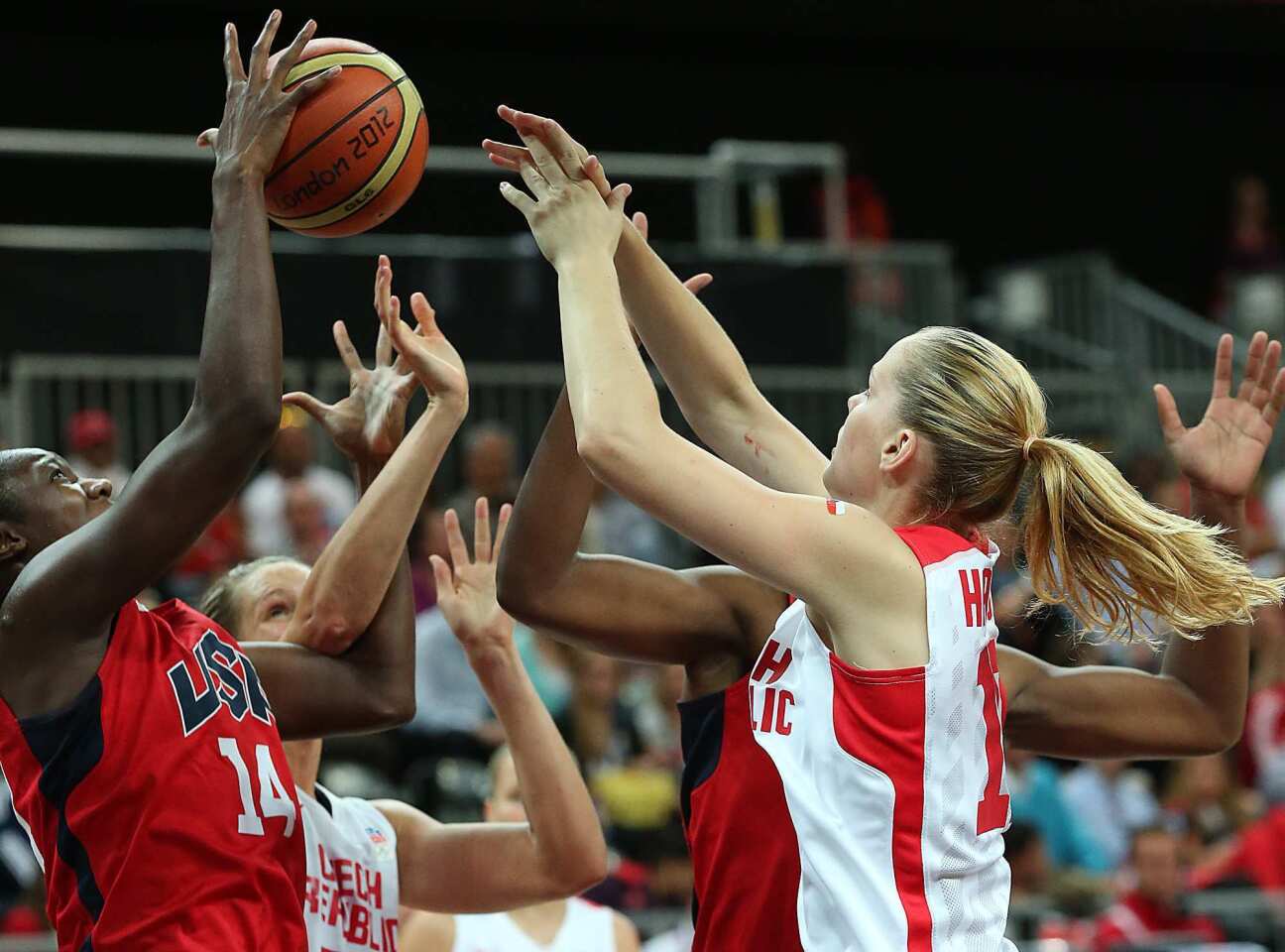 United States' Tina Charles, left, battles Czech Republic defenders for the ball.