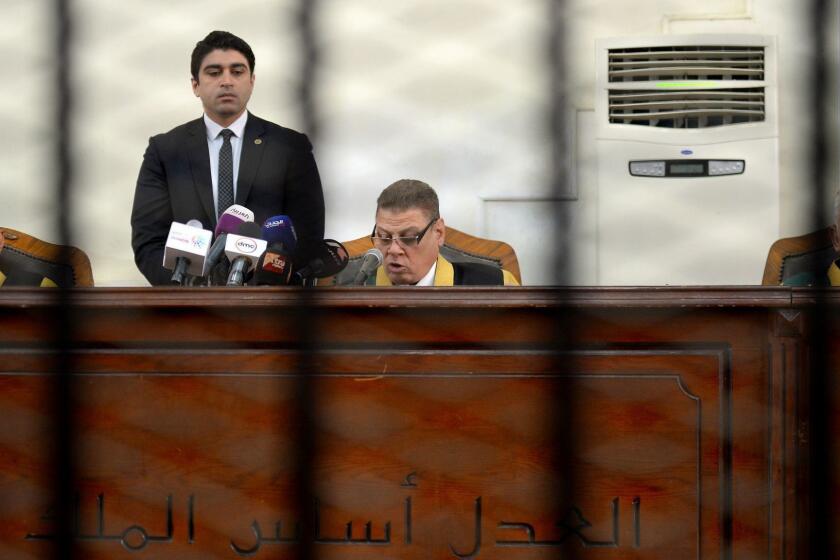 Egyptian judge Mohammed Fahmy (C) reads out the life sentence against Muslim Brotherhood businessman Hassan Malek (not seen in the picture) during the final session of his trial in Cairo on April 30, 2019. - The Islamist businessman, accused of harming the national economy through his business activities by depriving the market of foreign currency, was sentenced to life which is equivalent to 25 years in prison. (Photo by MOHAMED EL-SHAHED / AFP)MOHAMED EL-SHAHED/AFP/Getty Images ** OUTS - ELSENT, FPG, CM - OUTS * NM, PH, VA if sourced by CT, LA or MoD **