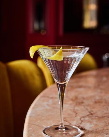 Gin Martini, Extra Dry with a twist, on a marble table at the Georgian Room