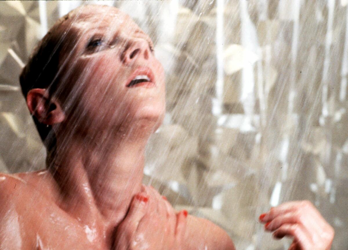 A close-up of a woman taking a shower.