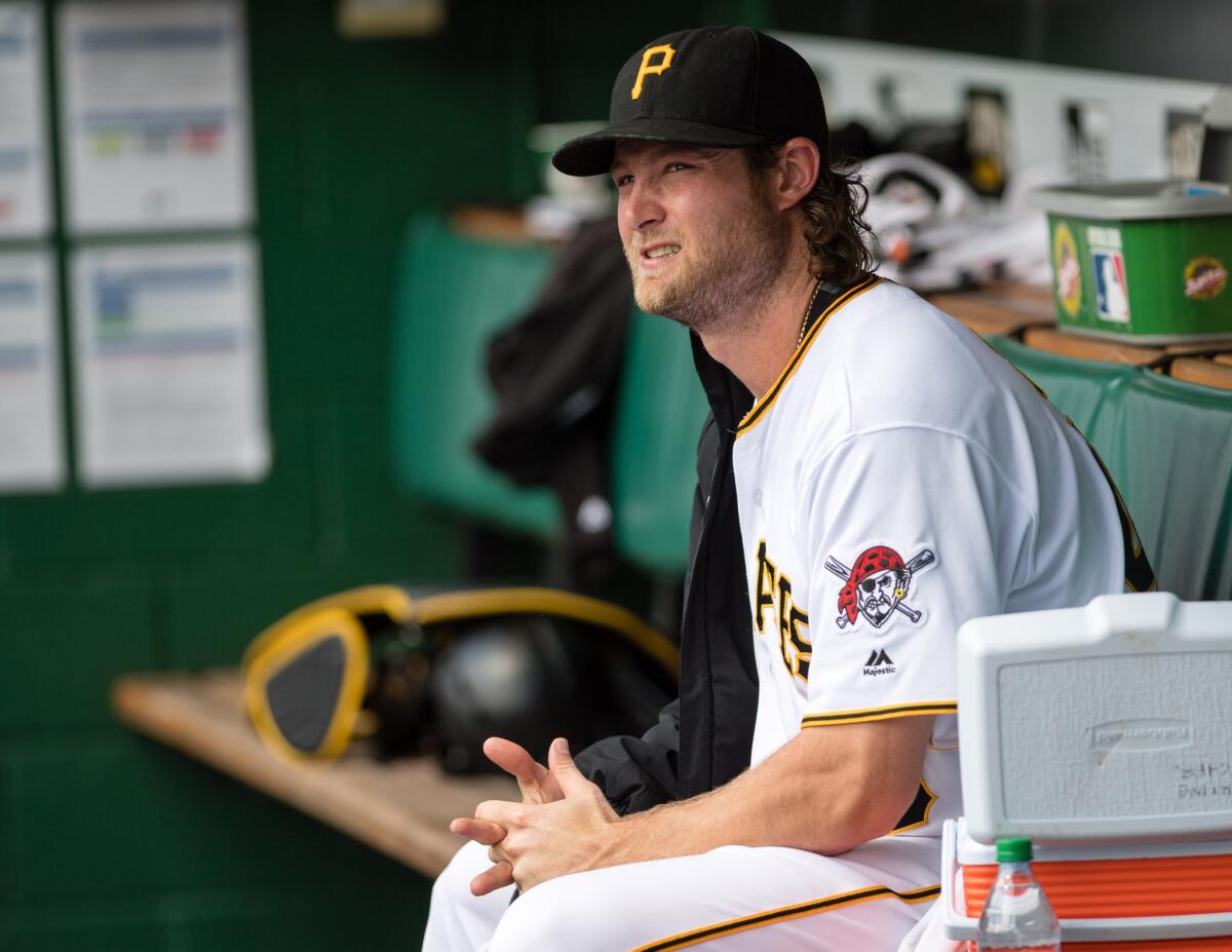 Pirates pitcher Gerrit Cole (45) sits in the dugout during a game against the Houston Astros on Aug. 24.