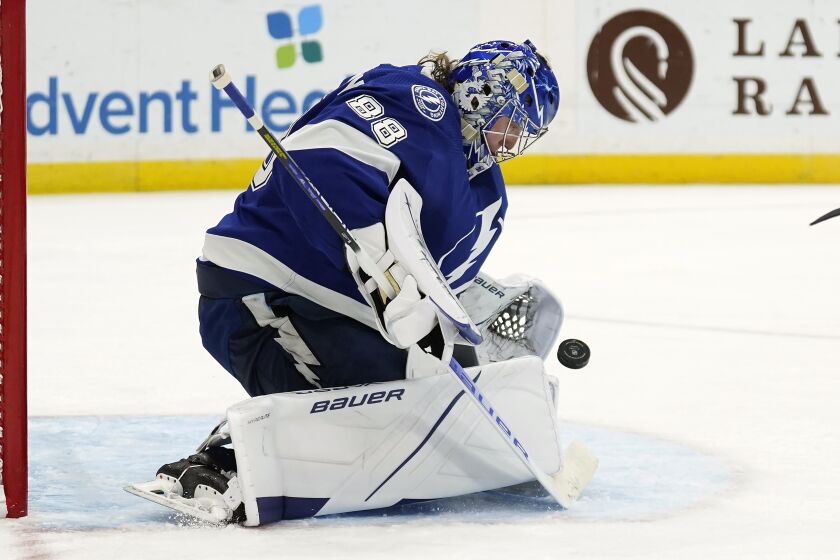 Tampa Bay Lightning goaltender Andrei Vasilevskiy (88) makes a save on a shot by the Ottawa Senators during the third period of an NHL hockey game Thursday, Dec. 16, 2021, in Tampa, Fla. (AP Photo/Chris O'Meara)