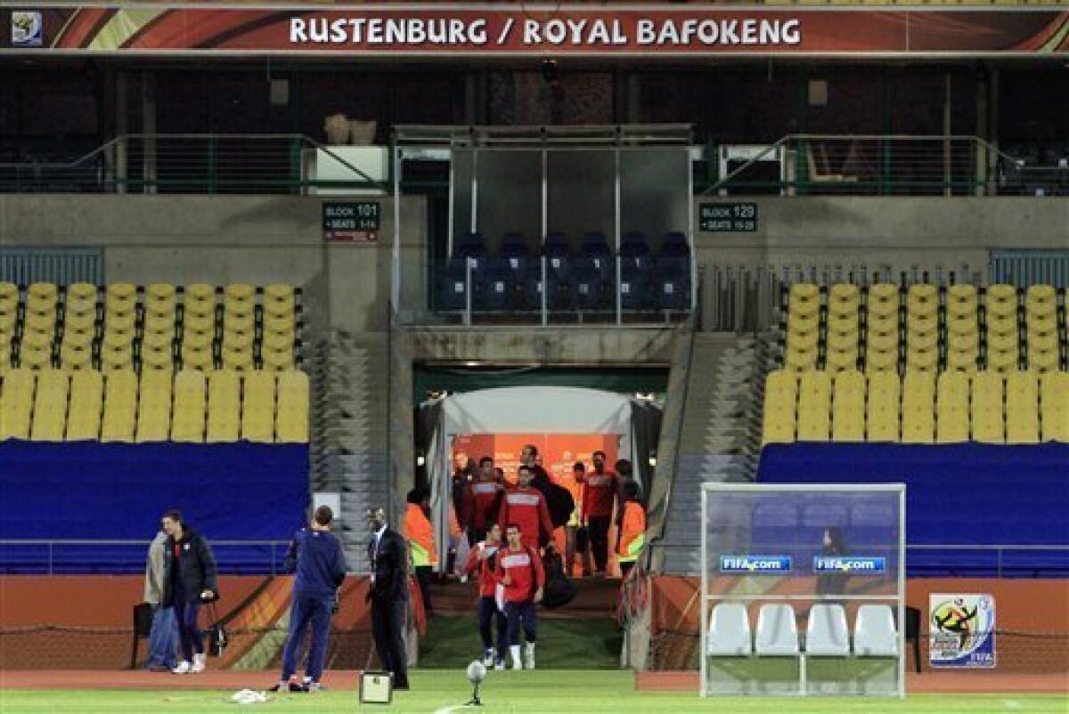 The U.S. national soccer team enters Royal Bafokeng Stadium for training in Rustenburg, South Africa, Friday, June 11, 2010. The U.S. will play England in a soccer World Cup Group C match on Saturday. (AP Photo/Elise Amendola)