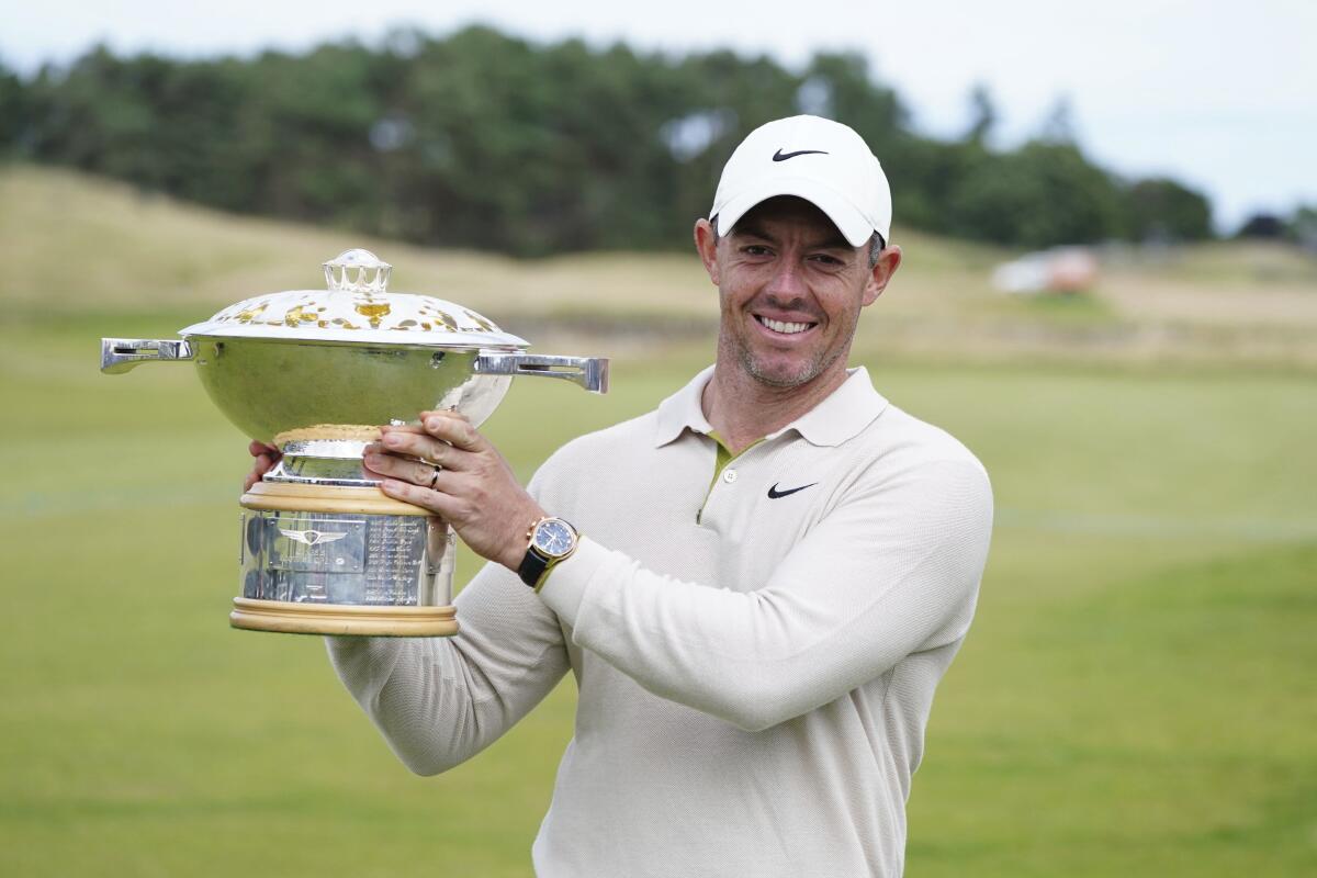 Northern Ireland's Rory McIlroy lifts the trophy following day four of the Genesis Scottish Open.