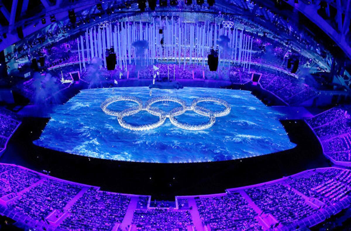 Dancers form the Olympic rings during the closing ceremony of the Winter Games on Feb. 23, 2014, in Sochi, Russia.