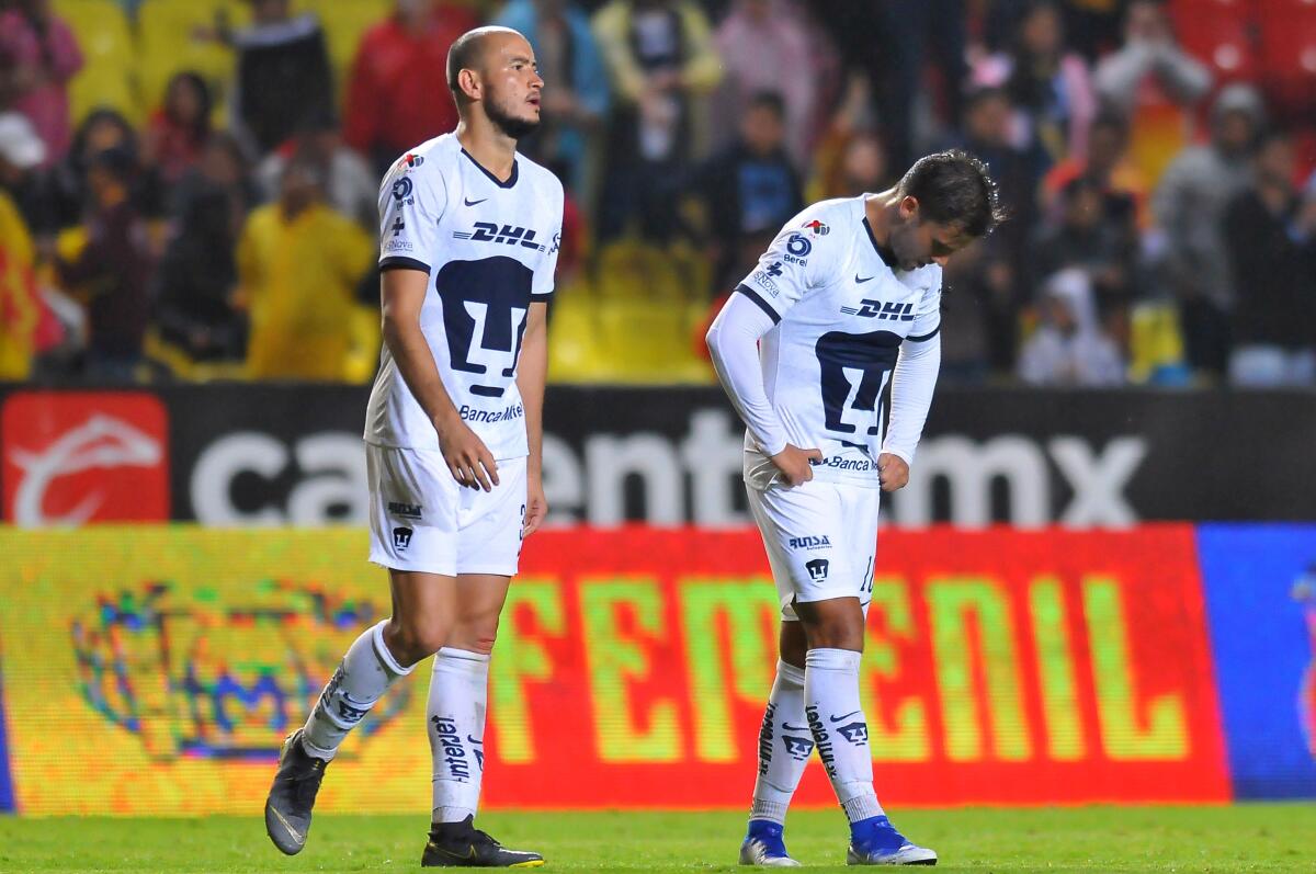 Carlos Gonzalez (L) and Andres Iniesta of Pumas react during the Mexican Apertura 2019 tournament football match between Morelia and Pumas at Morelos stadium in Morelia, Michoacan state, Mexico on August 23, 2019. (Photo by VICTOR CRUZ / AFP)VICTOR CRUZ/AFP/Getty Images ** OUTS - ELSENT, FPG, CM - OUTS * NM, PH, VA if sourced by CT, LA or MoD **