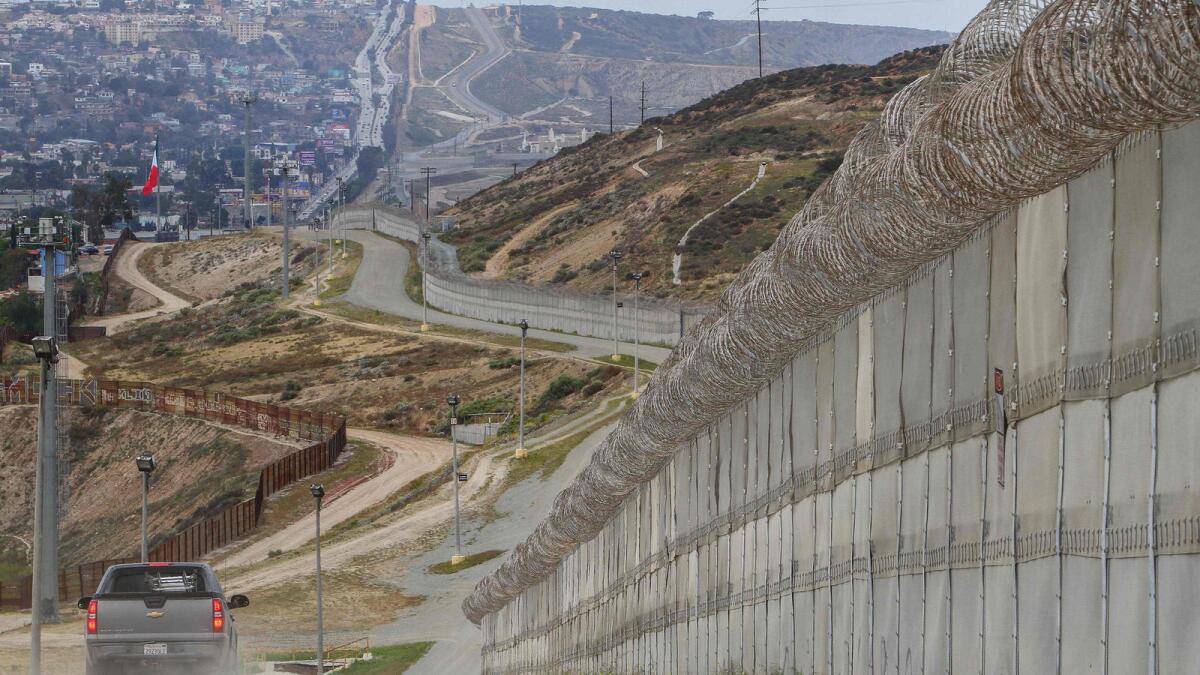 A pair of fences separates Mexico, left, and the U.S. south of San Diego.