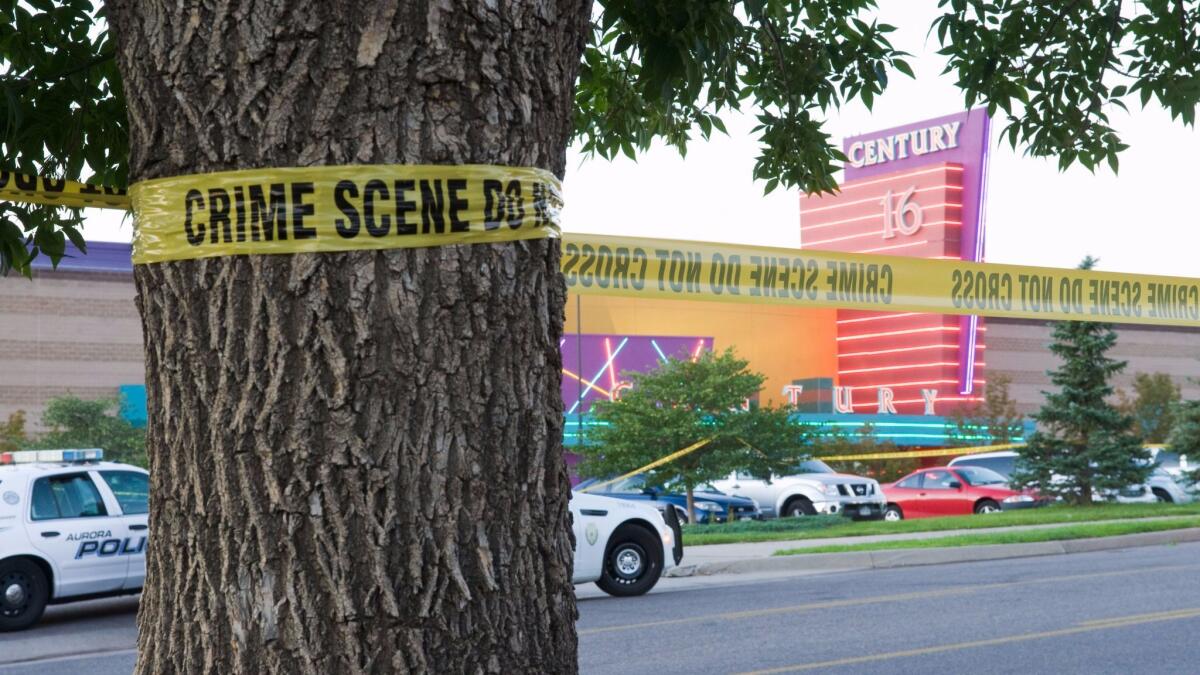 Police cars in front of the Century 16 theater in Aurora, Colo., where a gunman opened fire during the opening of "The Dark Knight Rises" on July 20, 2012.