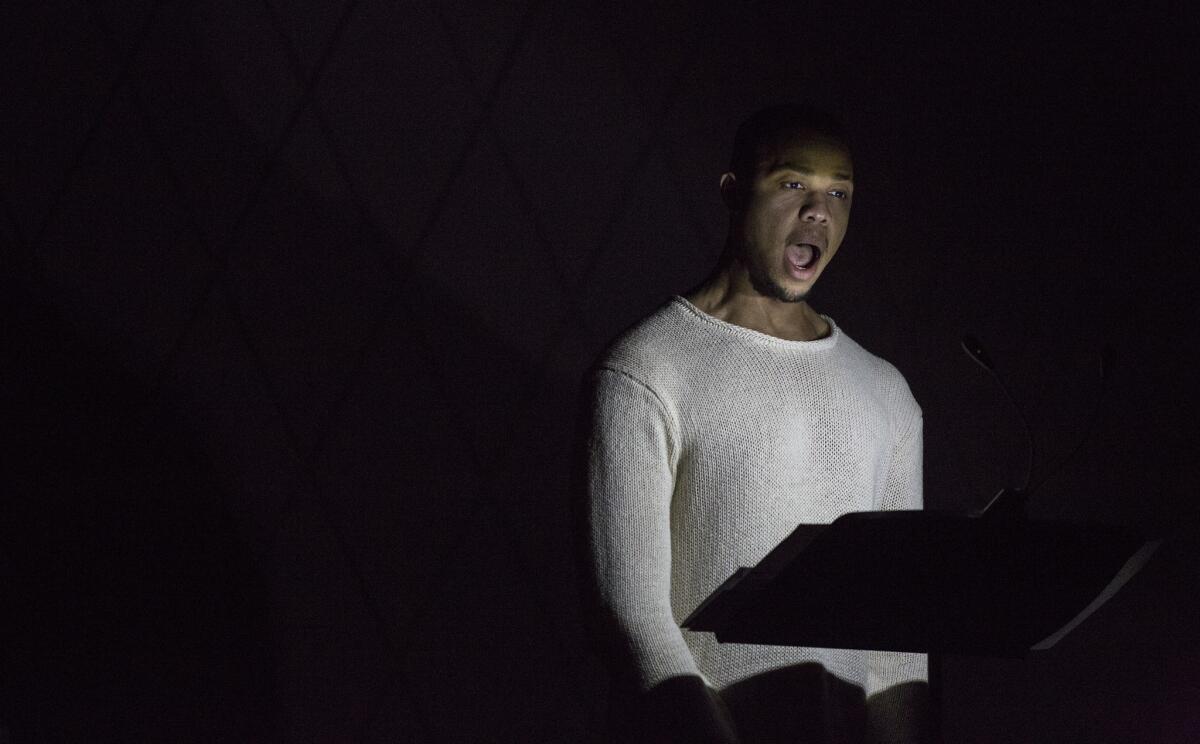 Bass-baritone Davone Tines performs Julius Eastman's "Prelude to the Holy Presence of Joan d' Arc" in Zipper Concert Hall.