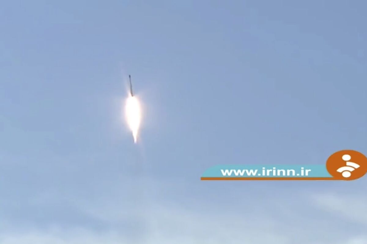 TV footage of a rocket streaking through the sky