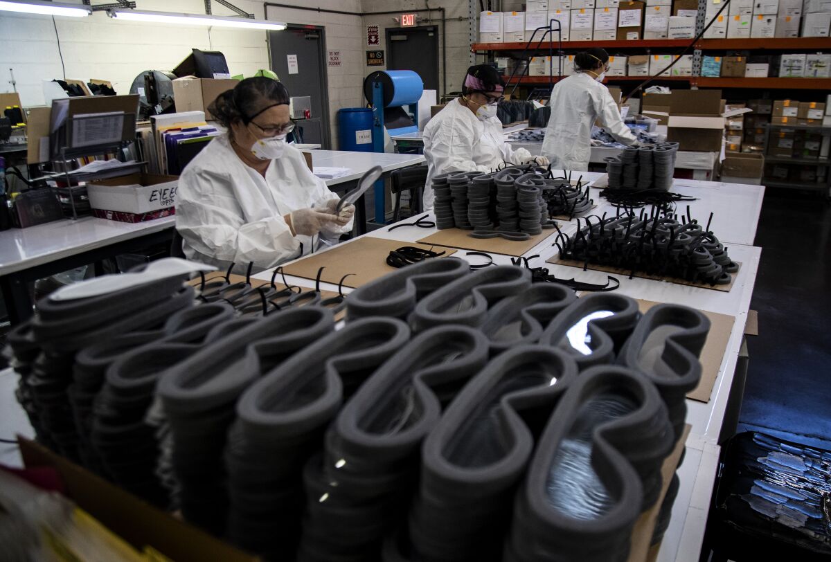 Paulson Manufacturing workers assemble goggles