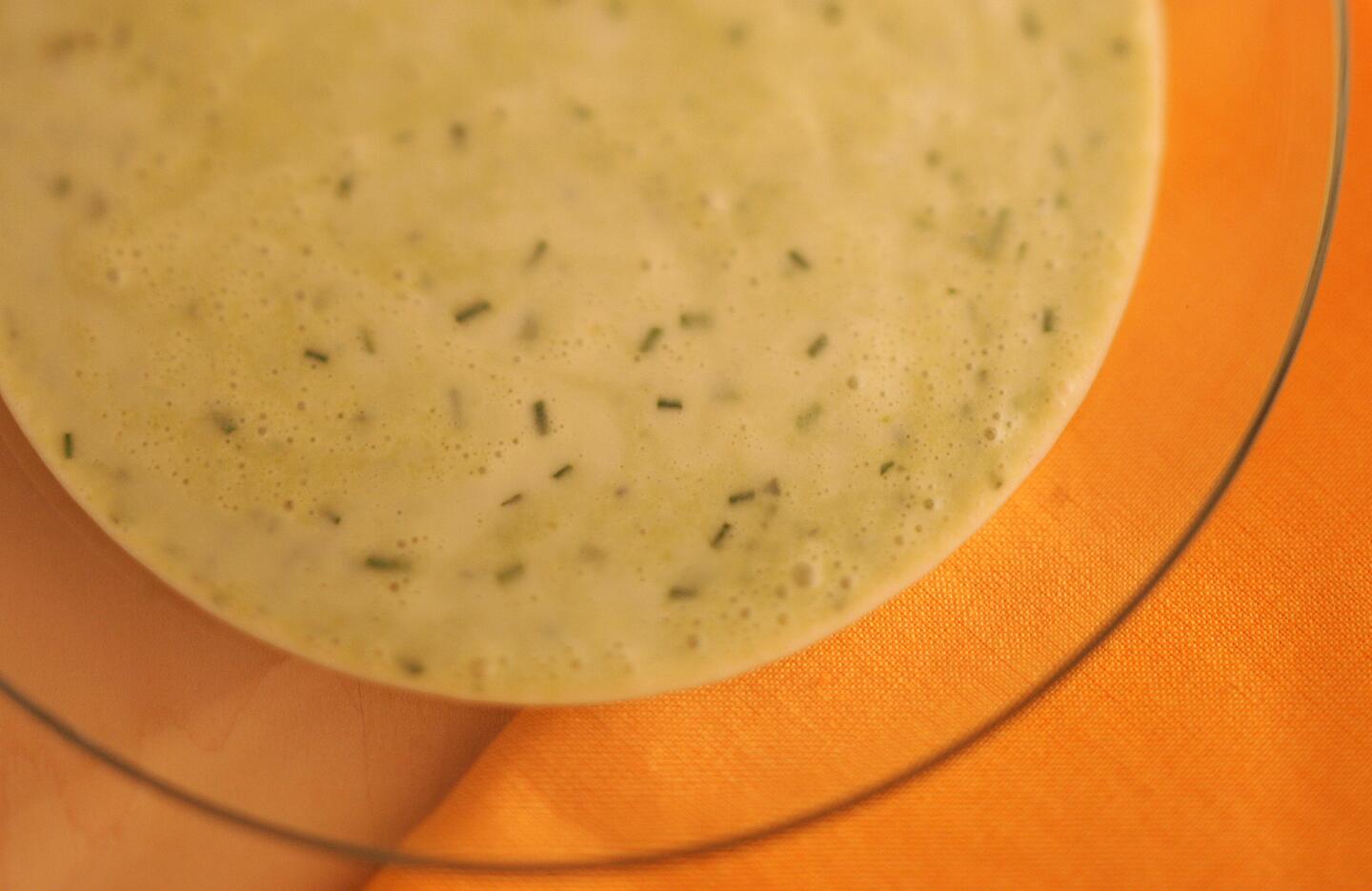 Fresh herbs and crème fraîche lighten chilled pea soup with fines herbes.