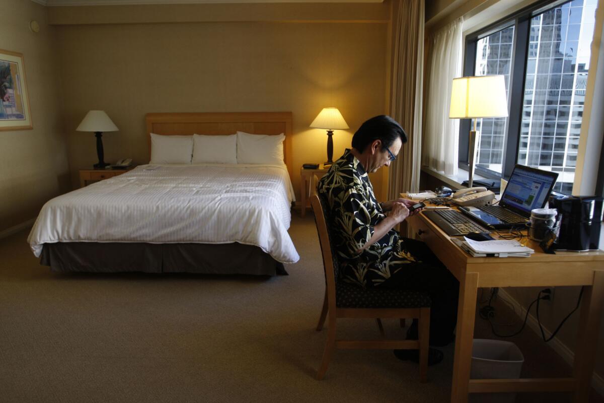 Attorney Richard Macias works in his room at the Wilshire Grand Hotel in downtwon Los Angeles. A study says that the U.S. ranks low in providing quality WiFi at hotels.