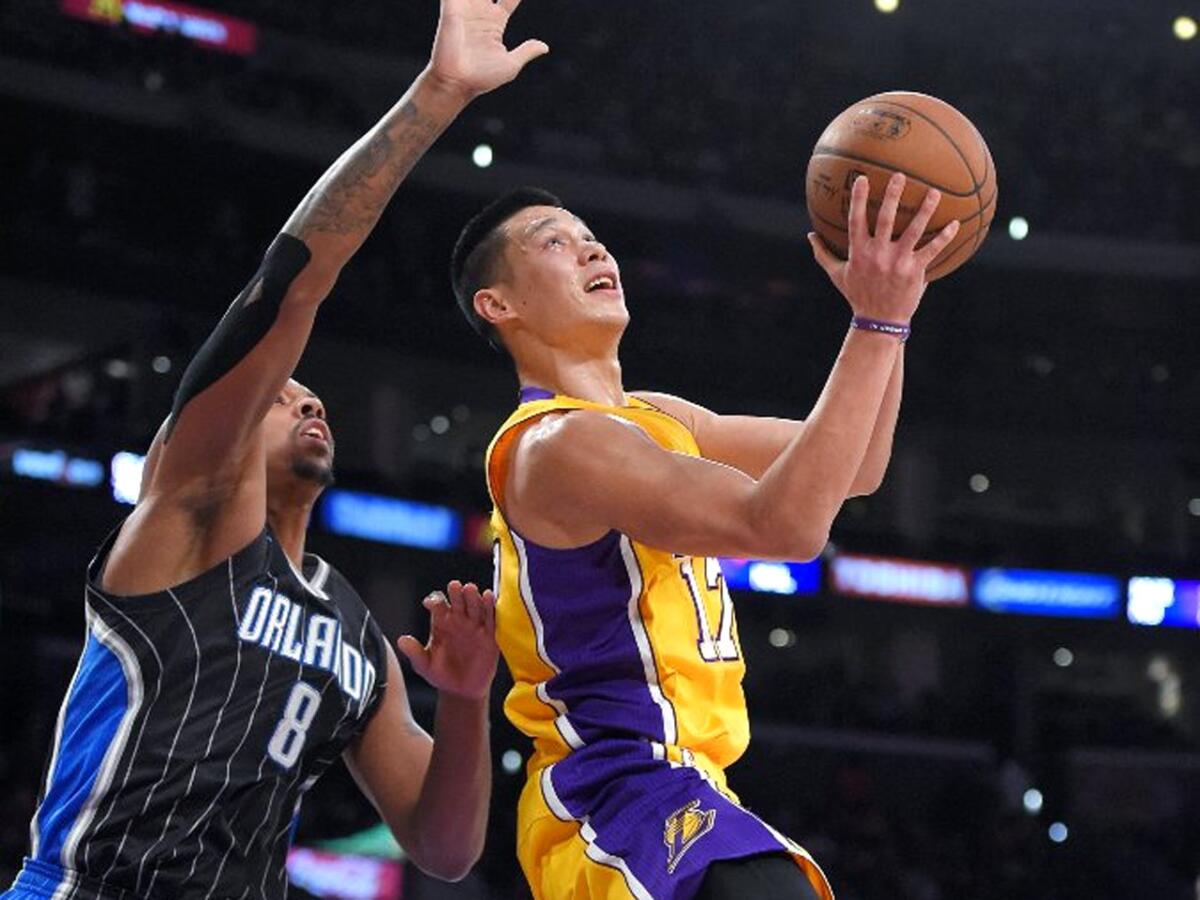 Lakers guard Jeremy Lin goes up for a shot against Orlando Magic forward Channing Frye at Staples Center on Jan. 9.