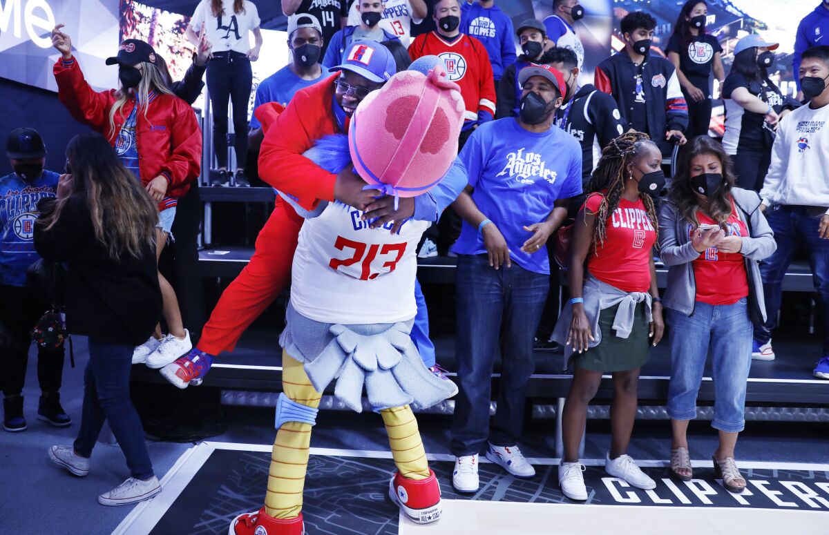 Clippers mascot Chuck embraces superfan Clippers Darrell.
