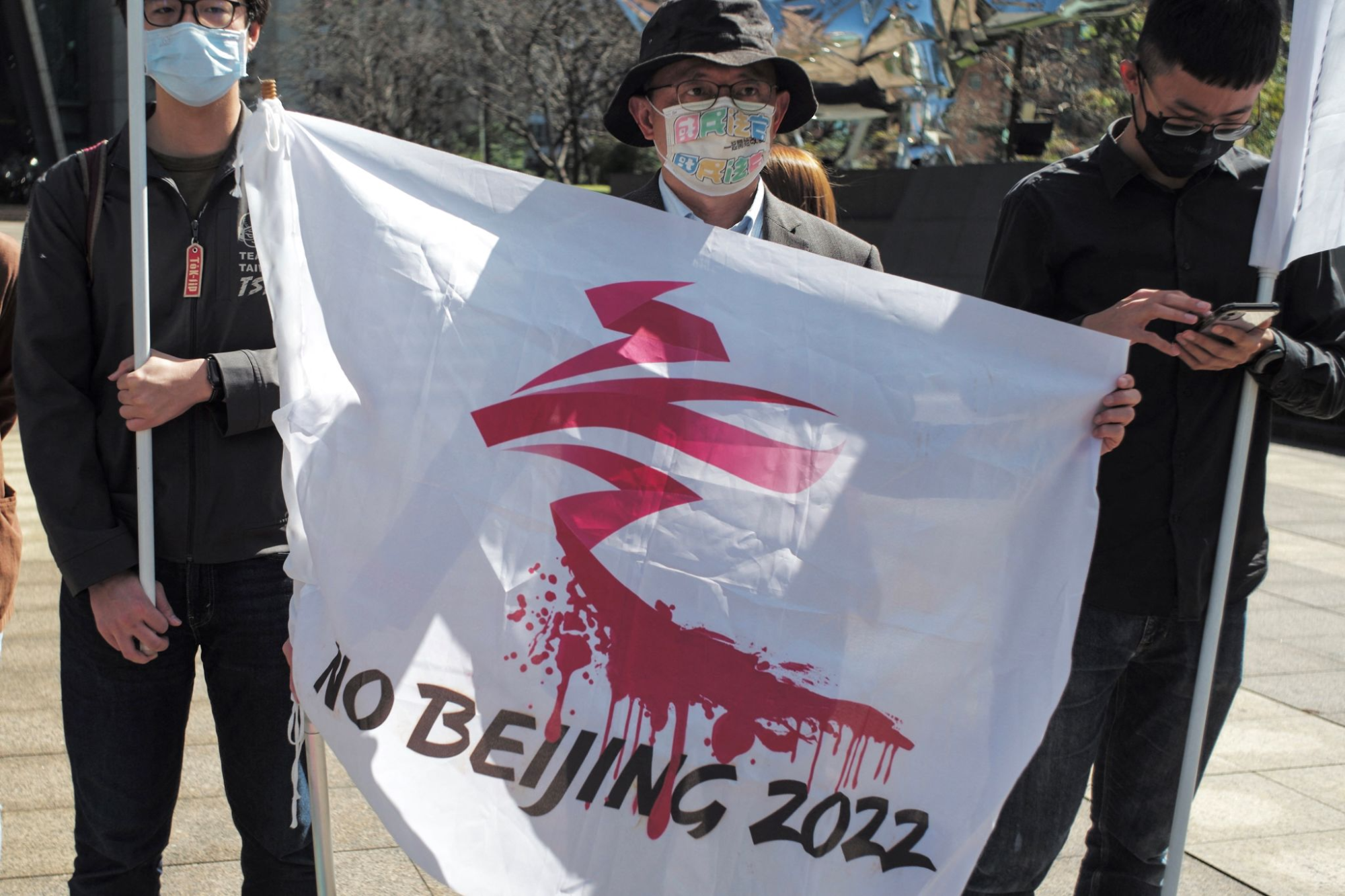 A protestor holds a flag during a demonstration against the Beijing Olympics in Taipei, Taiwan, on Wednesday.