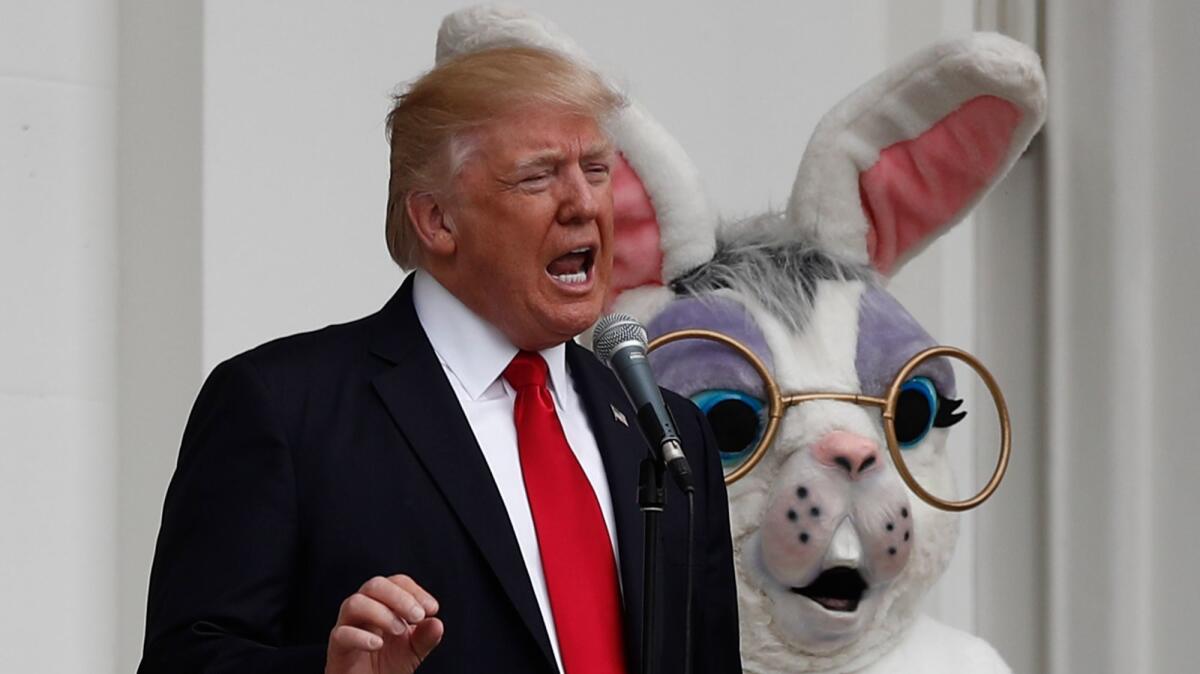 President Donald Trump, joined by the Easter Bunny, speaks from the Truman Balcony during the annual White House Easter Egg Roll on April 17.