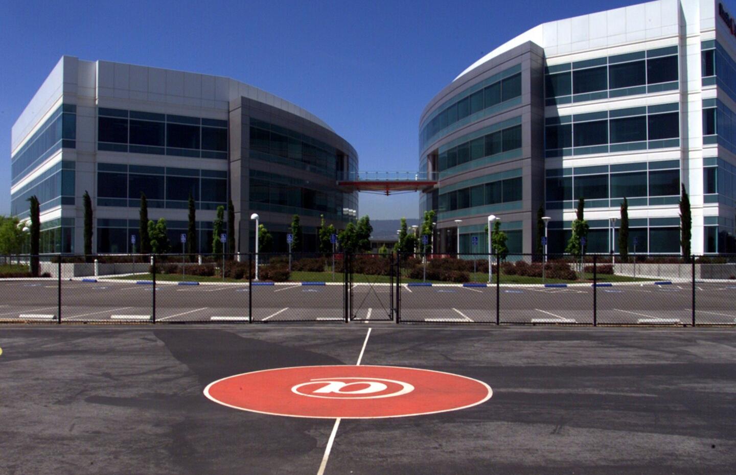 An employee basketball court and building sit vacant in Redwood City, part of the heart of Silicon Valley. The building used to house Excite, a dot-com company.