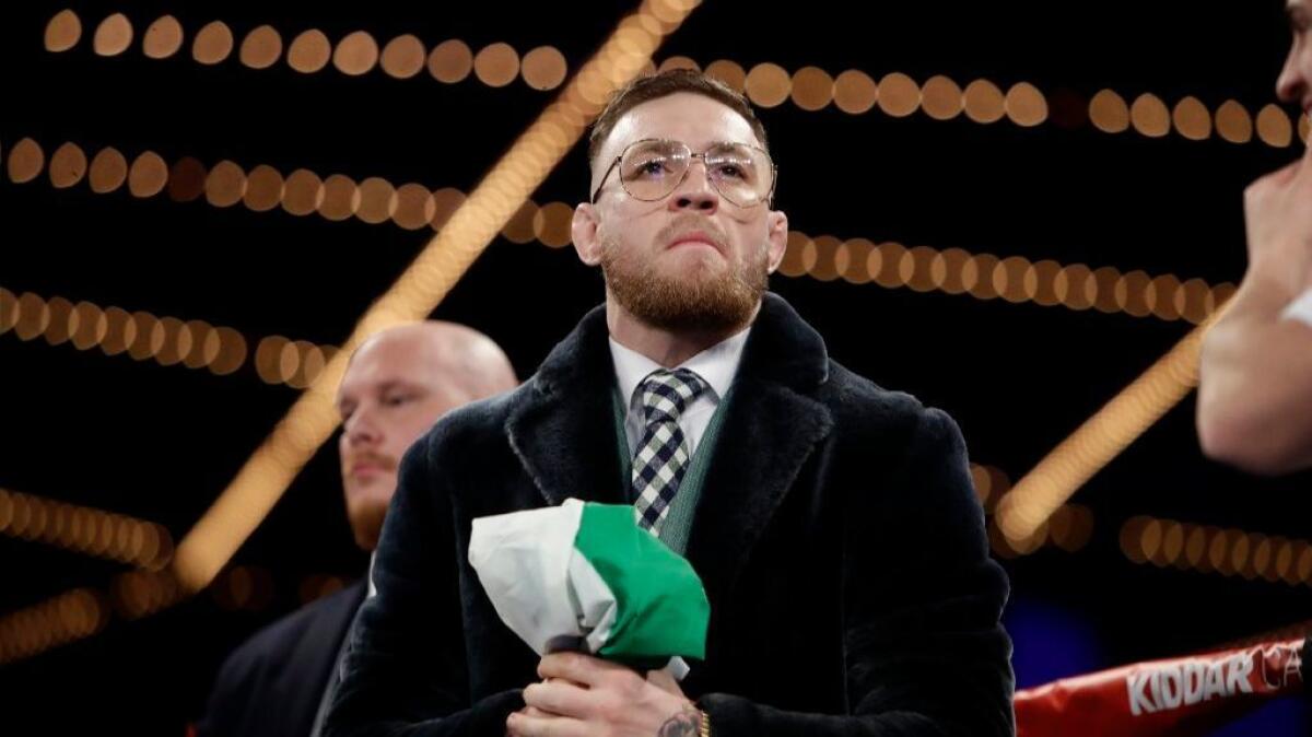 Conor McGregor stands in the ring before a super-bantamweight boxing match between Michael Conlan and Tim Ibarra on St. Patrick's Day in New York.
