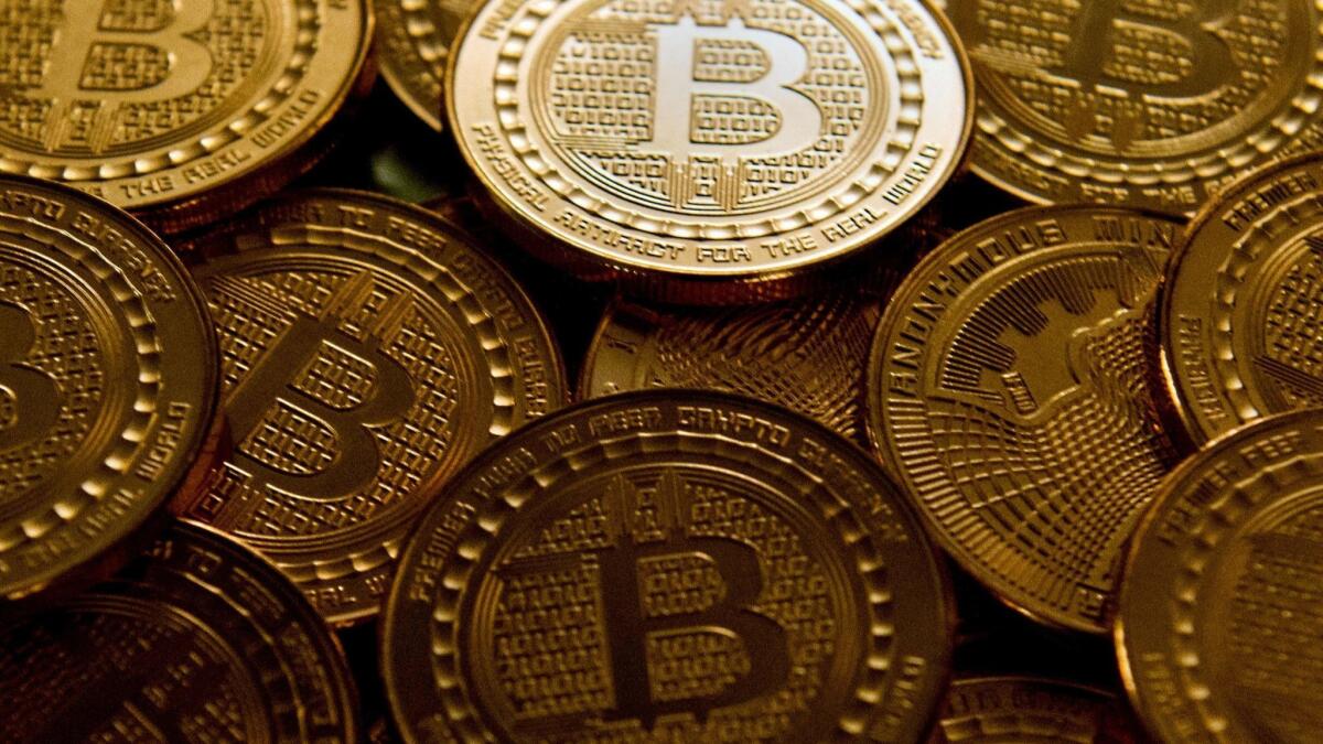 Medallions emblazoned with the bitcoin logo.