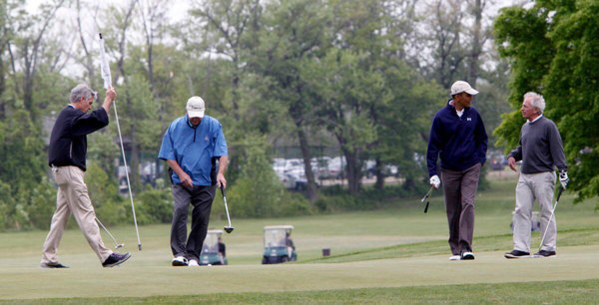 President Barack Obama, second from right, plays golf with, from left, Sen. Mark Udall (D-Colo.), Sen. Saxby Chambliss (R-Ga.) and Sen. Bob Corker (R-Tenn.) at Andrews Air Force Base.