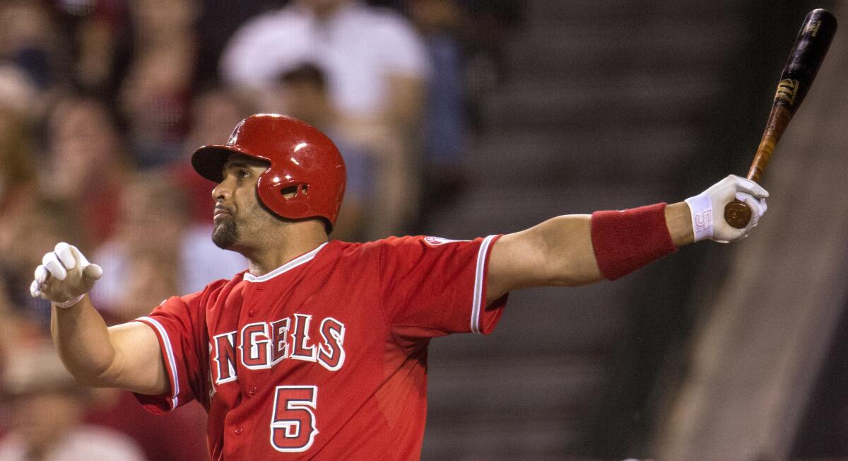 Angels first baseman Albert Pujols follows through on a two-run home run against the Astros on June 22, 2015, in Anaheim.
