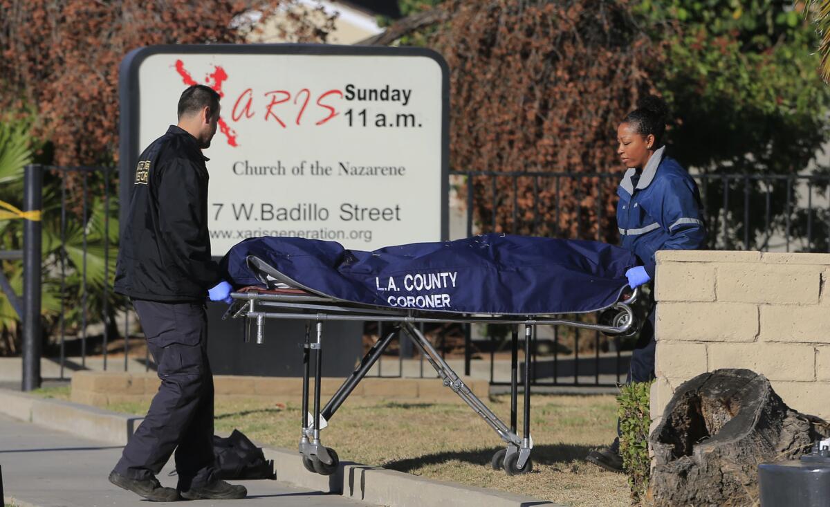 Los Angeles County coroner's officials remove the body of a man who was shot to death in front of the Church of the Nazarene at 1417 W. Badillo St. in West Covina.