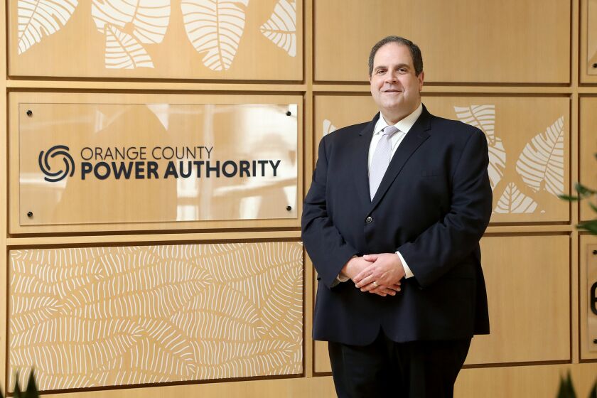 Brian Probolsky, Orange County Power Authority CEO, poses for a portrait at his office in Irvine on Tuesday. The Orange County Power Authority begins residential service to the four cities it serves, including Huntington Beach, on October 1. (Kevin Chang / Daily Pilot)