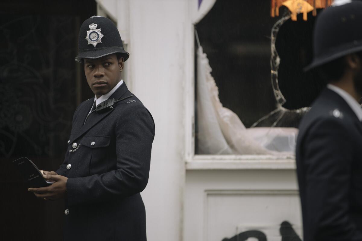 John Boyega looks to the side in a scene from Steve McQueen's "Red, White and Blue"