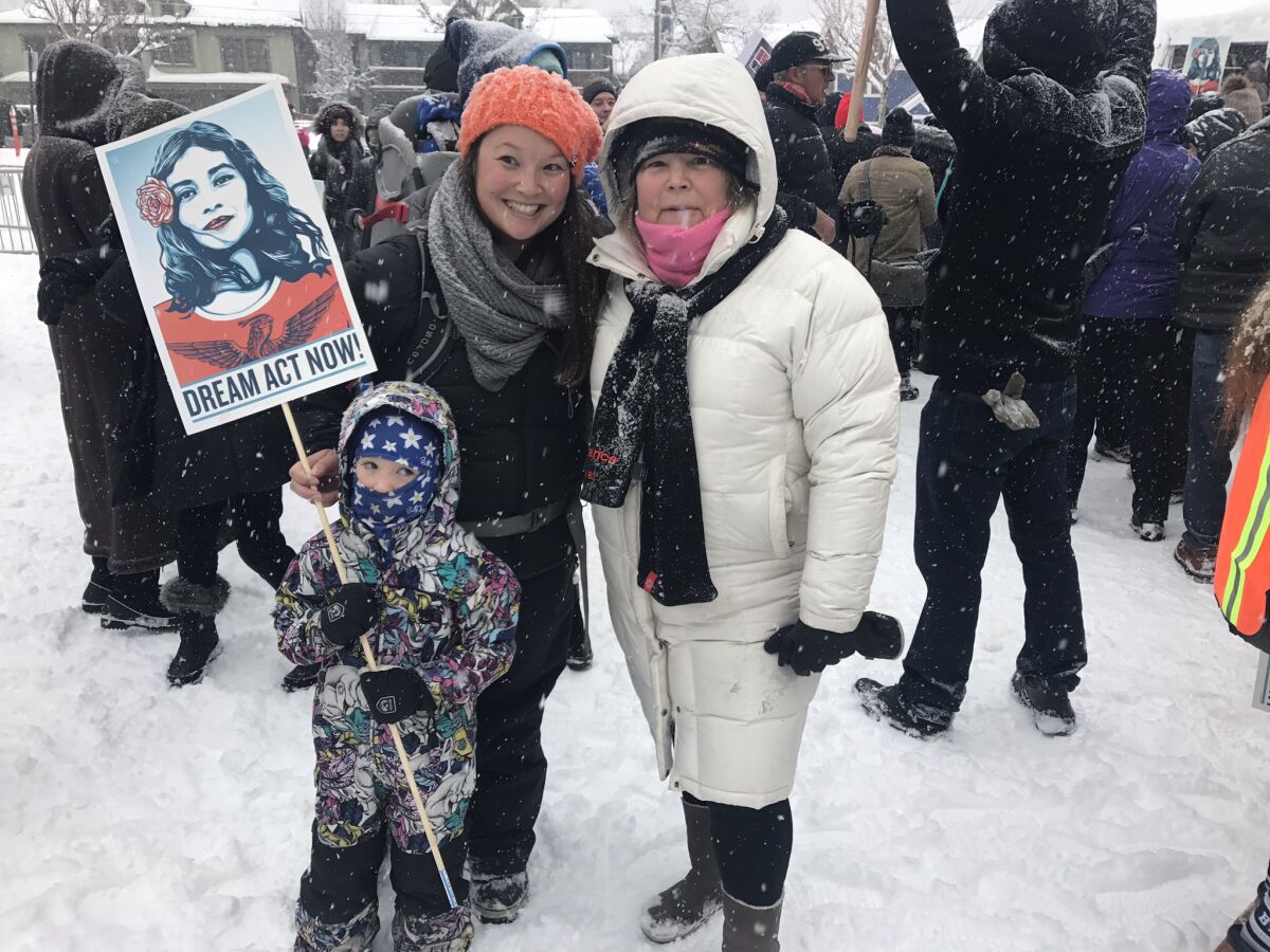 Three generations at the Respect Rally in Park City: Emily Gaudet, her son Bennett and daughter Eloise, and mom Cindy Matsumoto.