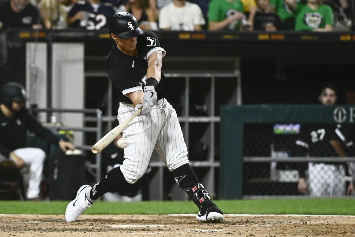 Chicago White Sox's Andrew Vaughn hits an RBI single against the Detroit Tigers during the seventh inning of a baseball game Saturday, Aug. 13, 2022, in Chicago. (AP Photo/Matt Marton)