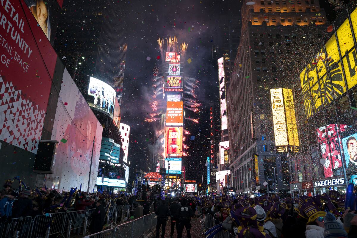 In this Jan. 1. 2017 file photo, confetti falls as people celebrate the new year in New York's Times Square.