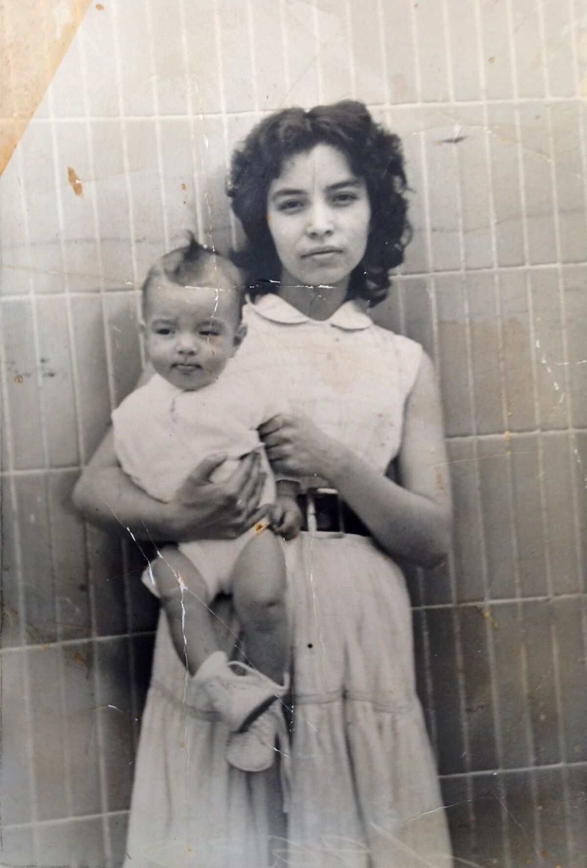 The writer's grandmother, Carolina, holding the writer's father, in Mexico City in 1956.