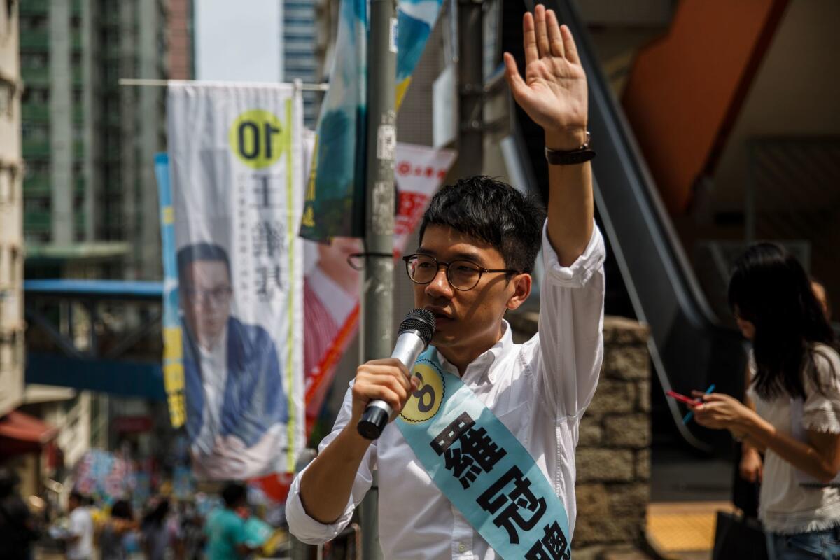 Nathan Law, 23, a leader of the 2014 pro-democracy rallies, campaigns for his political party Demosisto party during the Legislative Council election in Hong Kong on Sept. 4, 2016.