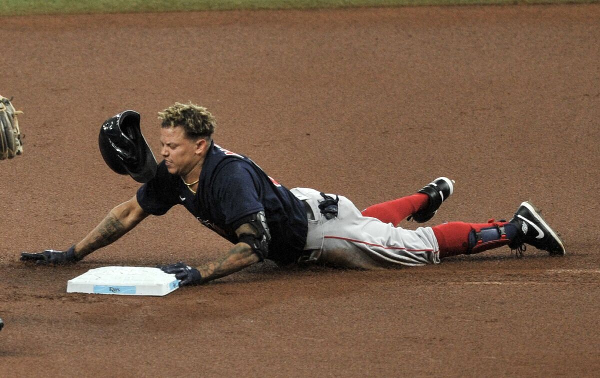 Boston Red Sox's Yairo Munoz slides into second base with a double off Tampa Bay Rays starter Charlie Morton during the first inning of a baseball game Sunday, Sept. 13, 2020, in St. Petersburg, Fla. (AP Photo/Steve Nesius)